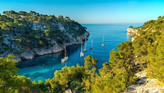 overlooking the port pin calanque boats on tourquise water