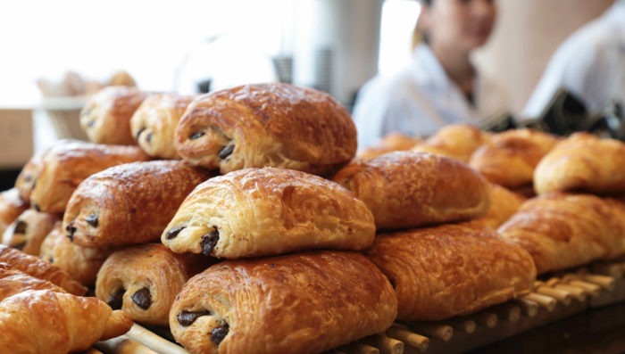 pile of pain au chocolate pasteries in french bakery